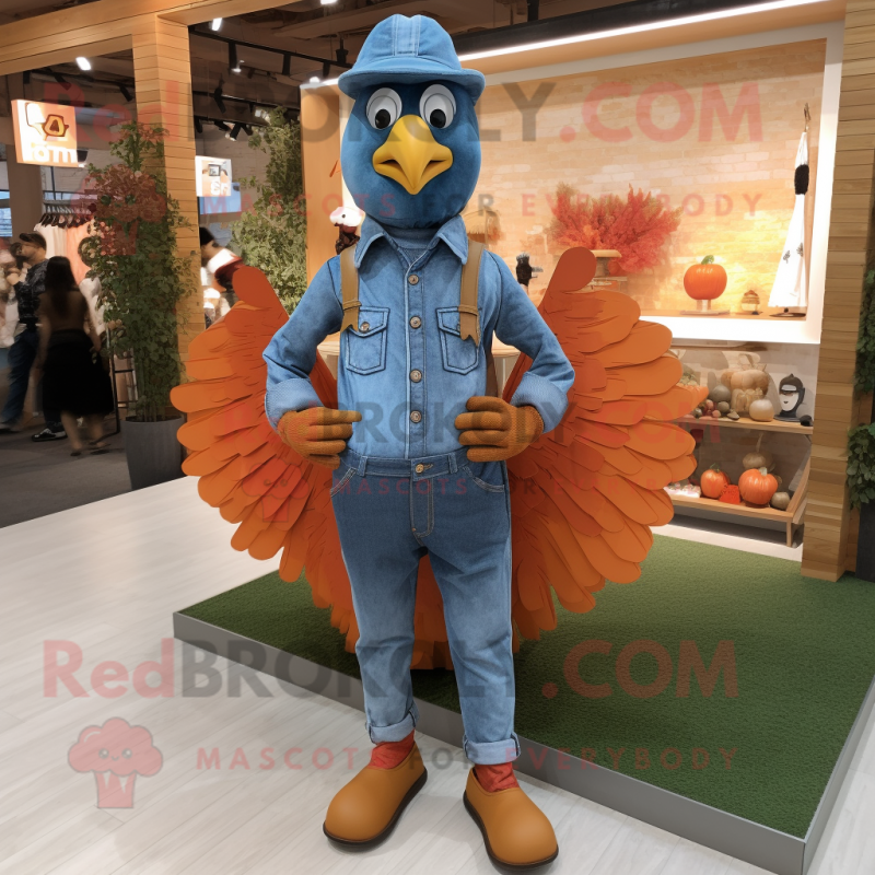 Orange Turkey mascot costume character dressed with a Chambray Shirt and Belts