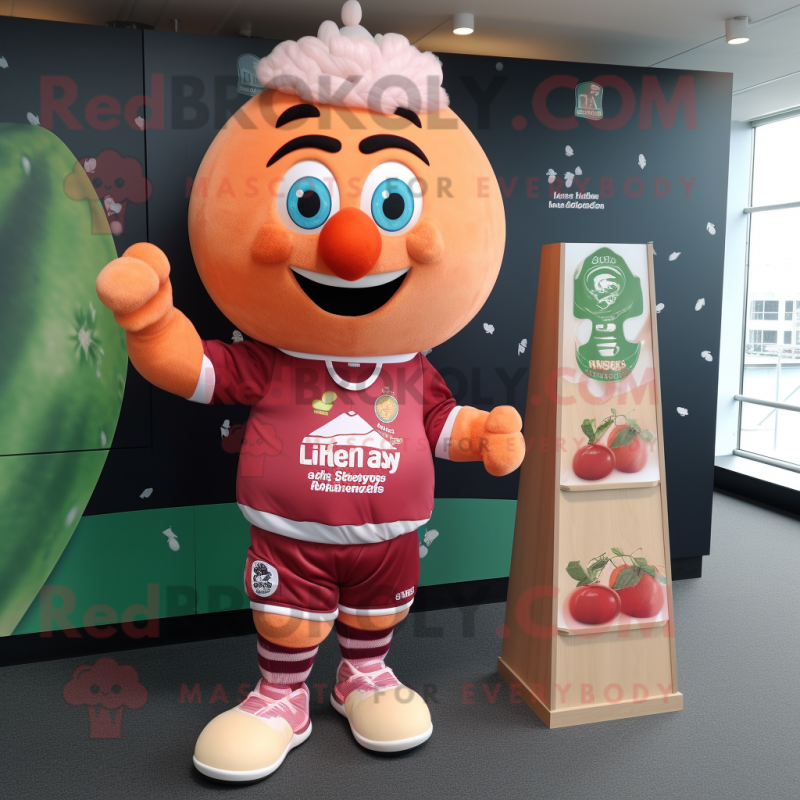 Peach Raspberry mascot costume character dressed with a Rugby Shirt and Cummerbunds