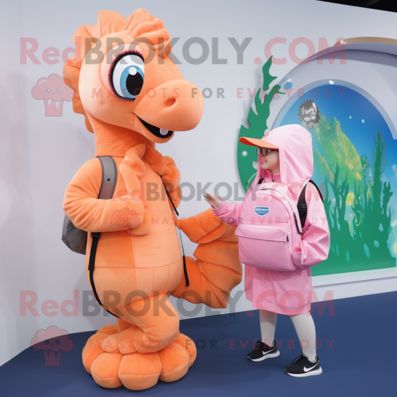 Peach Seahorse mascot costume character dressed with a Hoodie and Messenger bags