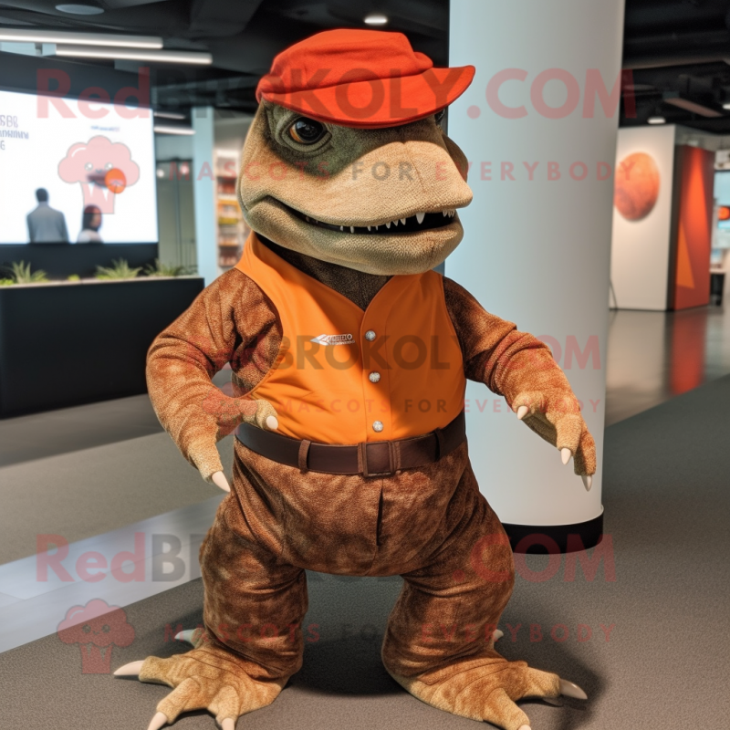 Rust Komodo Dragon mascot costume character dressed with a Culottes and Hat pins Rust Komodo Dragon mascot costume character dressed with a Culottes and Hat pins