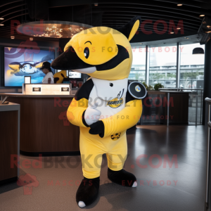 Yellow Killer Whale mascot costume character dressed with a Baseball Tee and Smartwatches