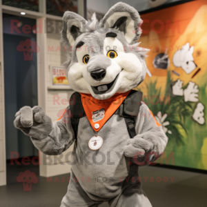 Gray Dingo mascot costume character dressed with a Vest and Foot pads