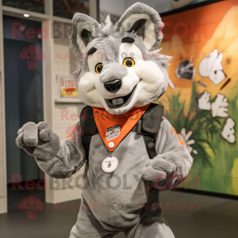 Gray Dingo mascot costume character dressed with a Vest and Foot pads Gray Dingo mascot costume character dressed with a Vest and Foot pads