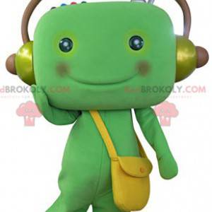 Mascotte de bonhomme vert avec un casque audio - Redbrokoly.com