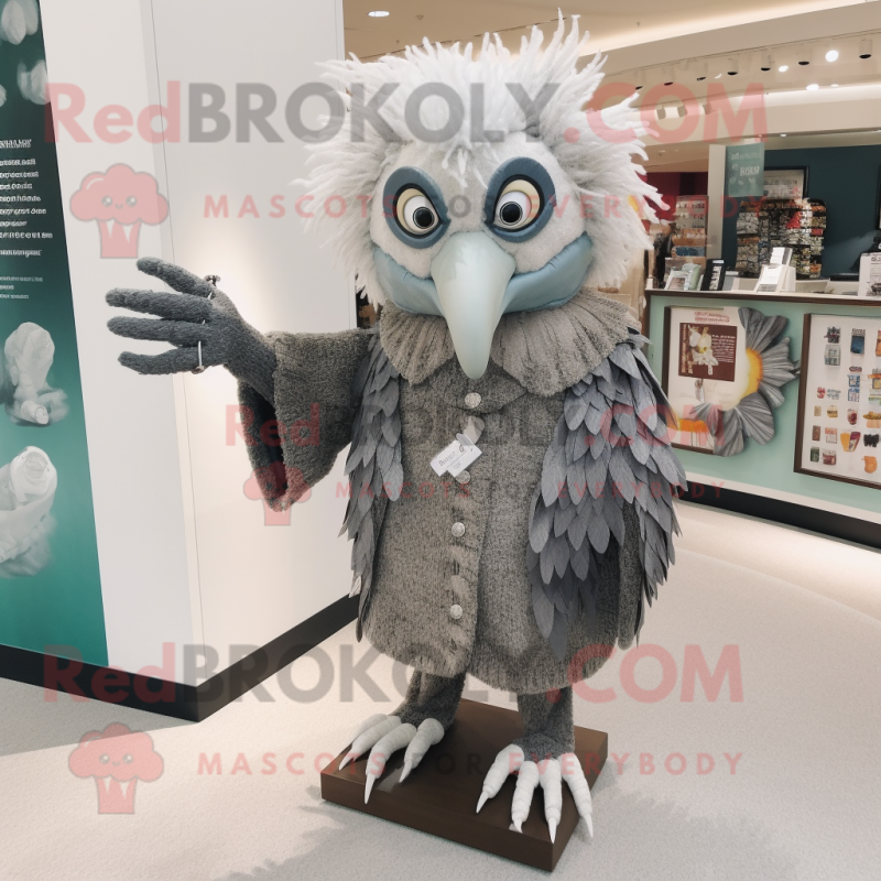 Gray Harpy mascot costume character dressed with a Sweater and Brooches