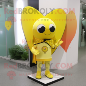 Lemon Yellow Arrow Of Love mascot costume character dressed with a Rash Guard and Shawls