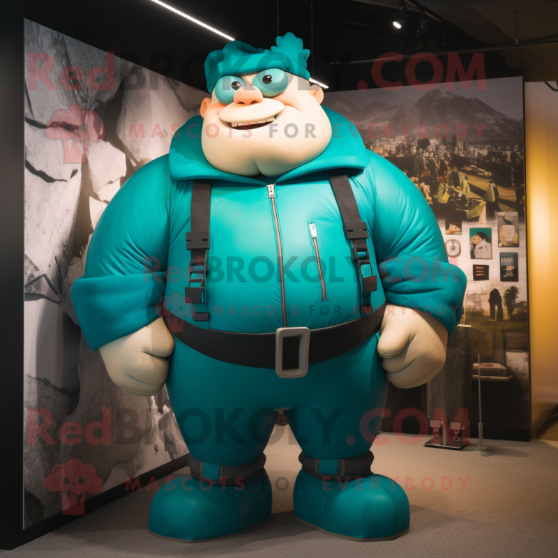 Teal Strongman mascot costume character dressed with a Bomber Jacket and Suspenders Teal Strongman mascot costume character dressed with a Bomber Jacket and Suspenders