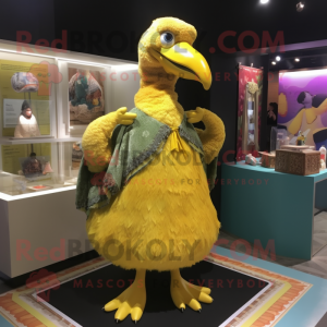 Gold Dodo Bird mascot costume character dressed with a Midi Dress and Shawls