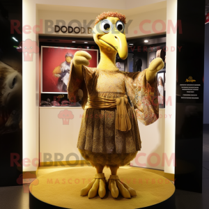 Gold Dodo Bird mascot costume character dressed with a Midi Dress and Shawls