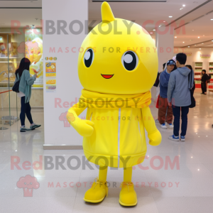 Lemon Yellow Candy mascot costume character dressed with a Skinny Jeans and Scarf clips