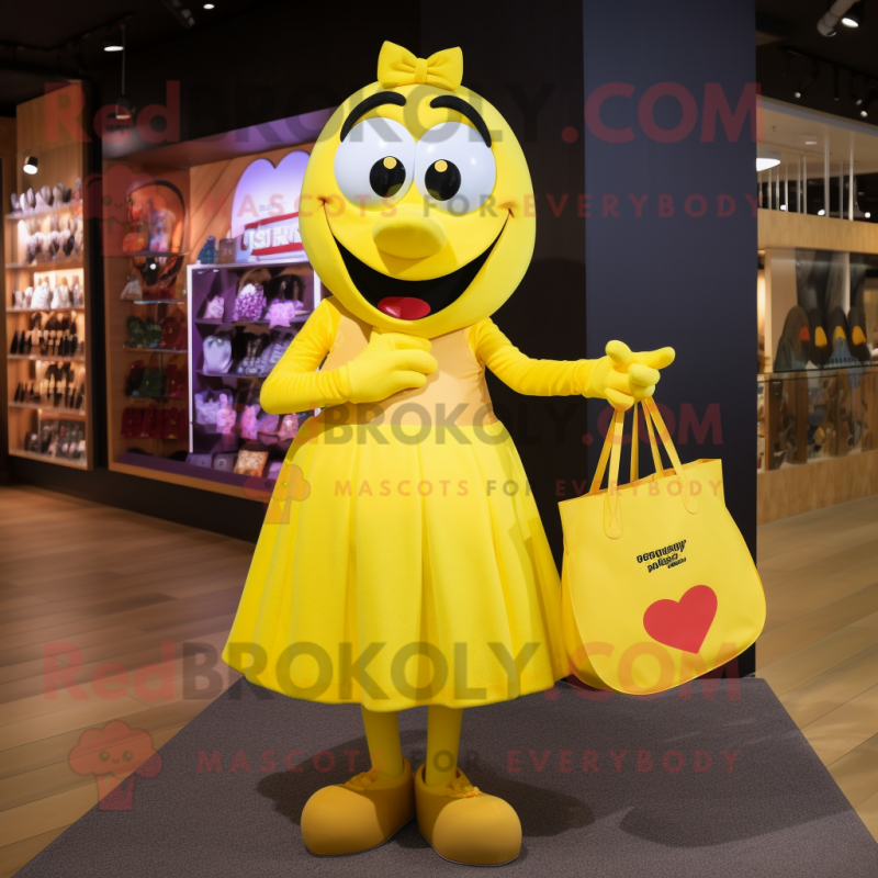 Yellow Heart mascot costume character dressed with a Maxi Skirt and Tote bags Yellow Heart mascot costume character dressed with a Maxi Skirt and Tote bags