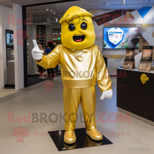 Gold Momentum mascot costume character dressed with a V-Neck Tee and Shoe clips