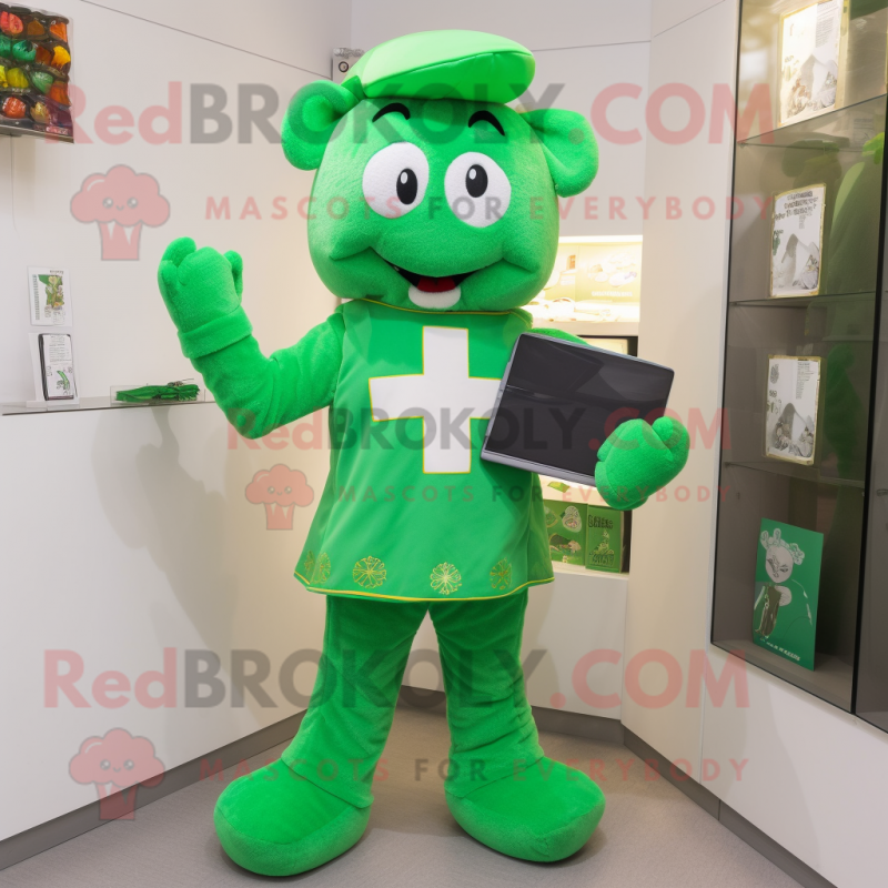 Green Celtic Cross mascot costume character dressed with a T-Shirt and Clutch bags Green Celtic Cross mascot costume character dressed with a T-Shirt and Clutch bags