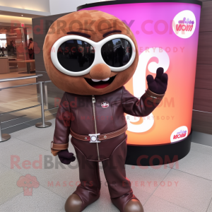 Brown Plum mascot costume character dressed with a Moto Jacket and Earrings