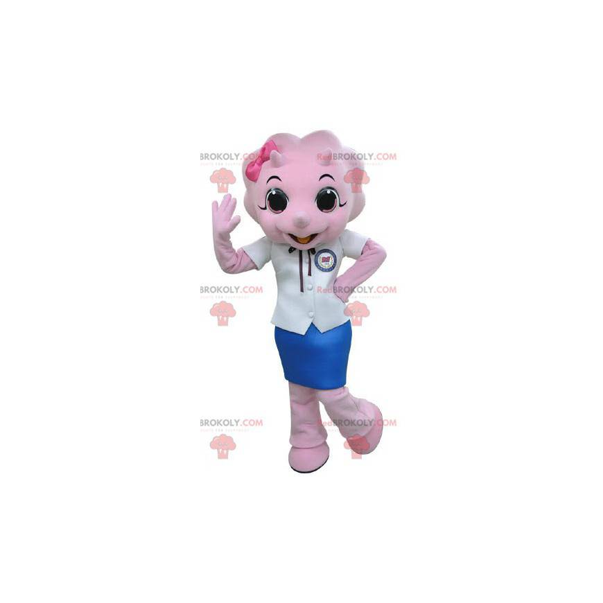 Mascote do rinoceronte rosa vestido com uma saia -