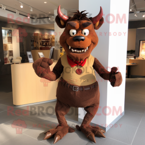 Brown Devil mascot costume character dressed with a Poplin Shirt and Earrings