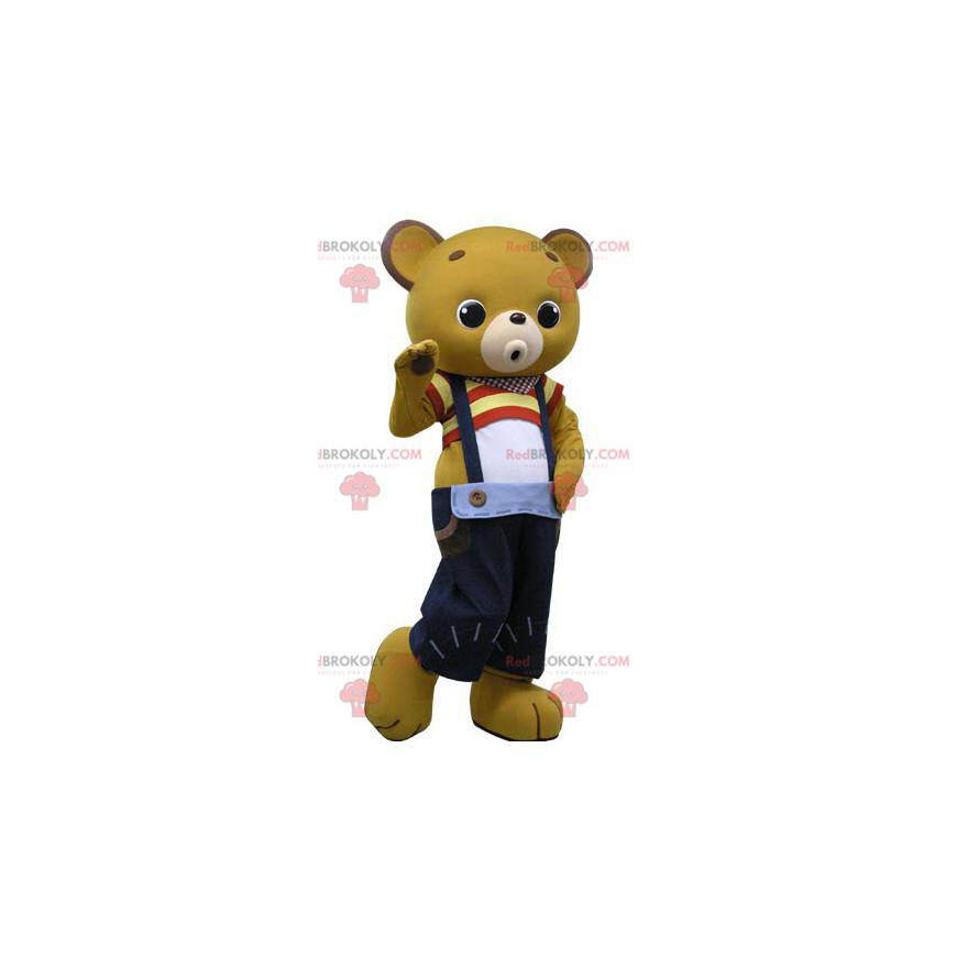 Mascote ursinho de pelúcia amarelo com macacão azul -