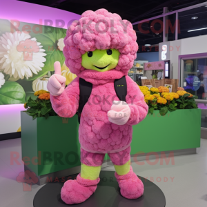 Pink Cauliflower mascot costume character dressed with a Sweater and Mittens