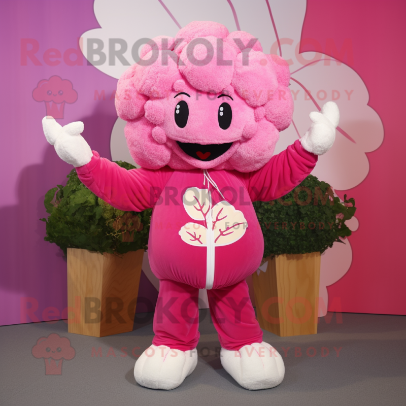 Pink Cauliflower mascot costume character dressed with a Sweater and Mittens