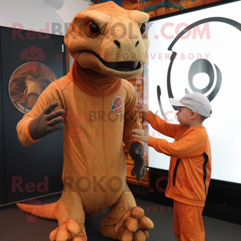 Rust Komodo Dragon mascot costume character dressed with a Long Sleeve Tee and Watches