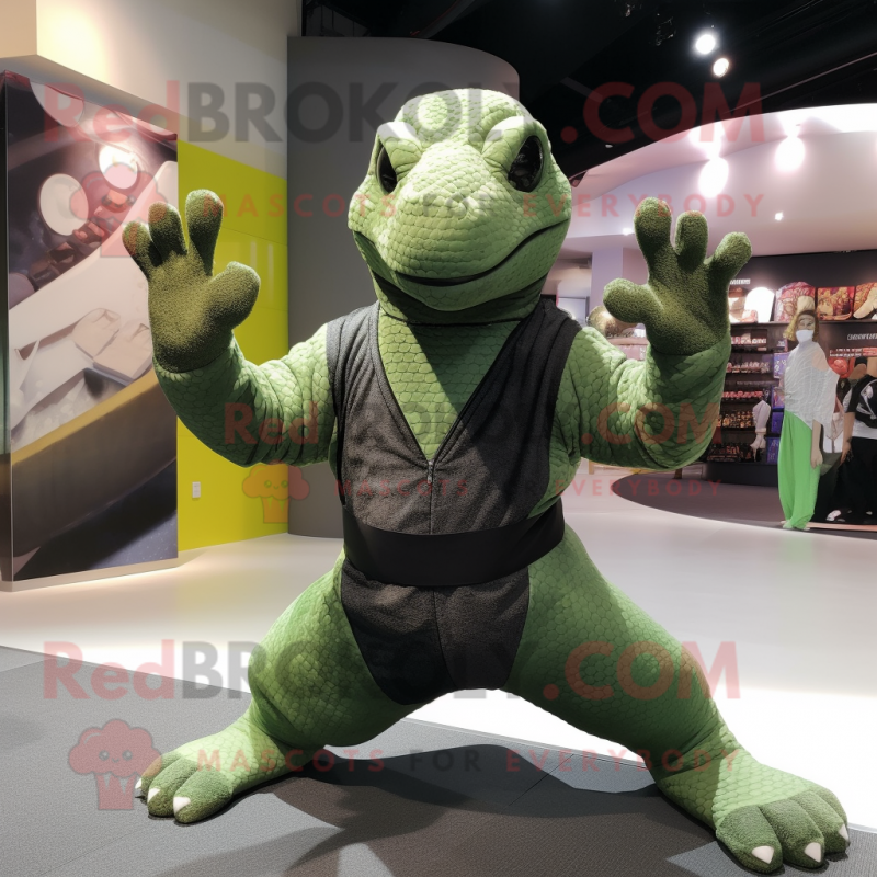 Olive Komodo Dragon mascot costume character dressed with a Yoga Pants and Gloves