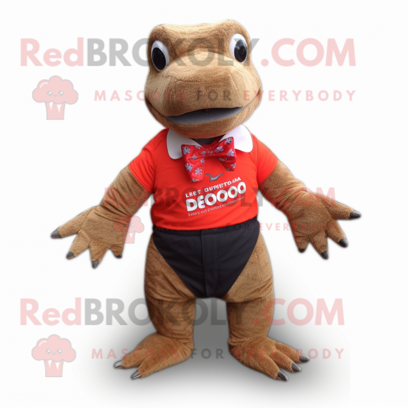 Red Komodo Dragon mascot costume character dressed with a Board Shorts and Bow ties Red Komodo Dragon mascot costume character dressed with a Board Shorts and Bow ties
