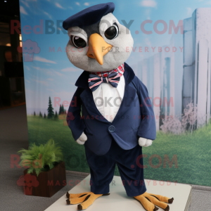 Navy Quail mascot costume character dressed with a Oxford Shirt and Bow ties