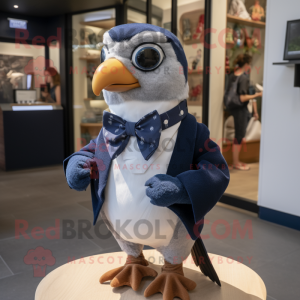 Navy Quail mascot costume character dressed with a Oxford Shirt and Bow ties