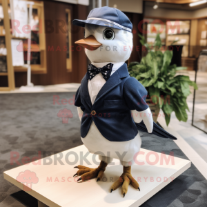 Navy Quail mascot costume character dressed with a Oxford Shirt and Bow ties