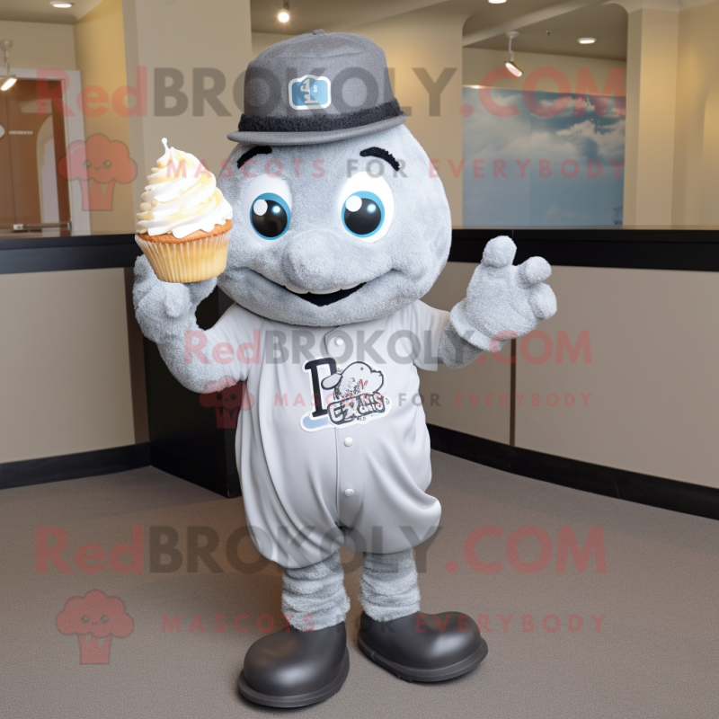 Silver Cupcake mascot costume character dressed with a Baseball Tee and Tie pins Silver Cupcake mascot costume character dressed with a Baseball Tee and Tie pins