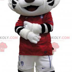 Svart og hvit tigermaskot kledd i rødt - Redbrokoly.com