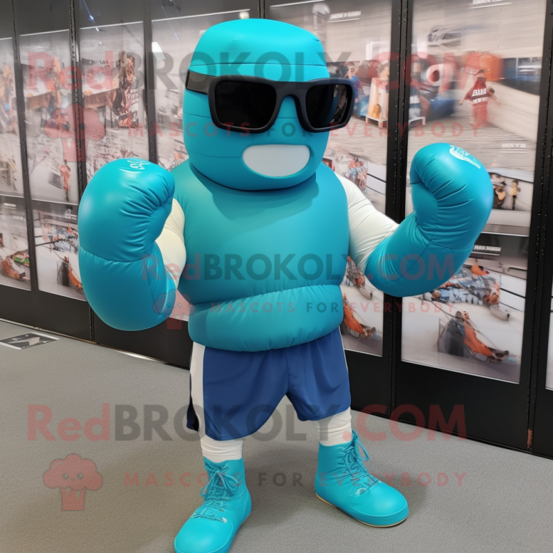 Turquoise Boxing Glove mascot costume character dressed with a Tank Top and Sunglasses Turquoise Boxing Glove mascot costume character dressed with a Tank Top and Sunglasses