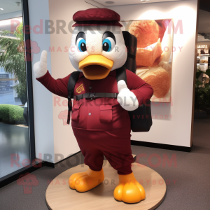 Maroon Duck mascot costume character dressed with a Dress Pants and Backpacks