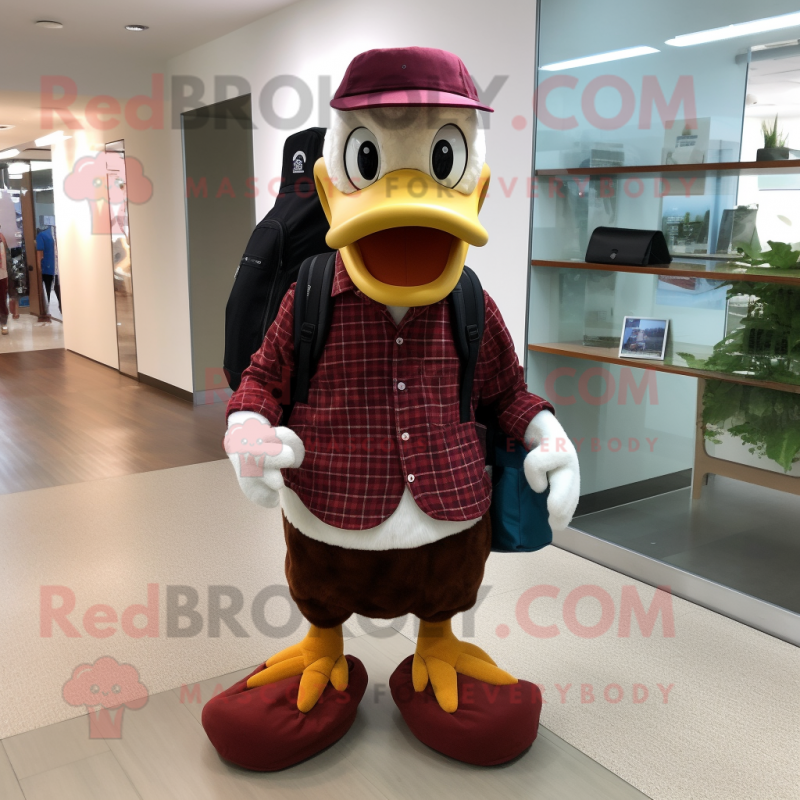 Maroon Duck mascot costume character dressed with a Dress Pants and Backpacks