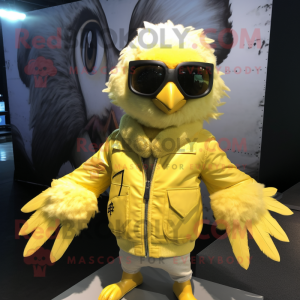 Lemon Yellow Harpy mascot costume character dressed with a Bomber Jacket and Sunglasses