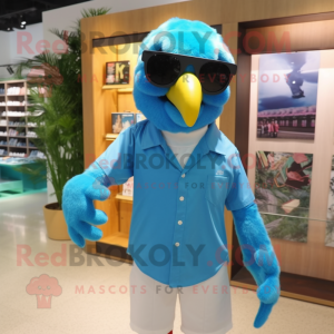 Turquoise Macaw mascot costume character dressed with a Dress Shirt and Sunglasses