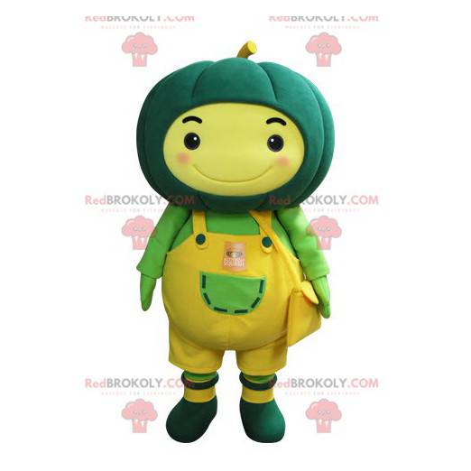 Yellow snowman mascot with a green pumpkin on his head -