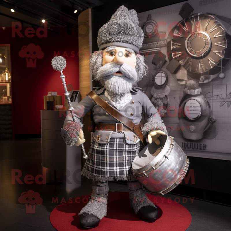 Silver Bagpipe mascot costume character dressed with a Waistcoat and Handbags Silver Bagpipe mascot costume character dressed with a Waistcoat and Handbags