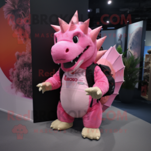 Pink Stegosaurus mascot costume character dressed with a Coat and Backpacks