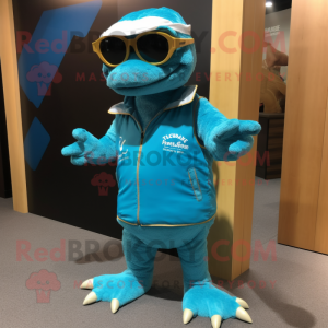 Cyan Komodo Dragon mascot costume character dressed with a Shorts and Sunglasses
