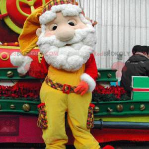 Mascote do Papai Noel vestido de amarelo e vermelho -