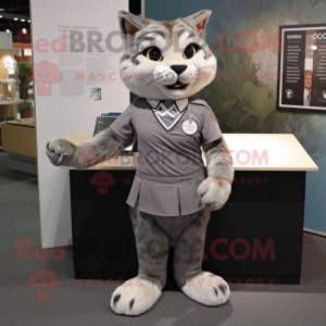 Gray Bobcat mascot costume character dressed with a Pleated Skirt and Lapel pins