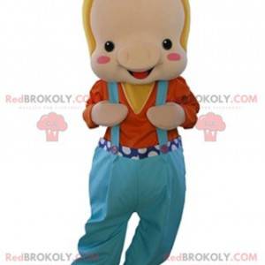 Mascote porco bege vestido de macacão - Redbrokoly.com