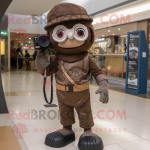 Brown Camera mascot costume character dressed with a Jeggings and Berets