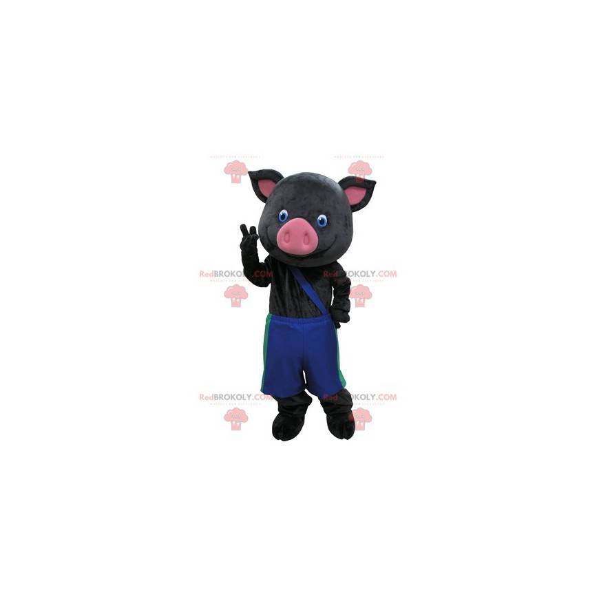 Czarno-różowa maskotka świnia z niebieskimi spodniami -