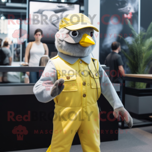Silver Canary mascot costume character dressed with a Jumpsuit and Suspenders