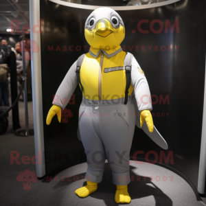 Silver Canary mascot costume character dressed with a Jumpsuit and Suspenders