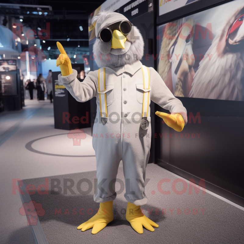 Silver Canary mascot costume character dressed with a Jumpsuit and Suspenders