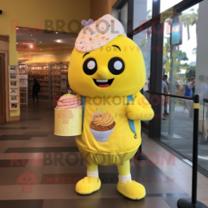 Lemon Yellow Cupcake mascot costume character dressed with a Henley Shirt and Messenger bags