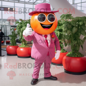 Pink Tomato mascot costume character dressed with a Blazer and Gloves